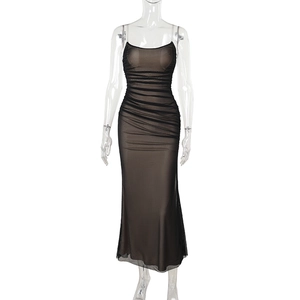 Detail of elegant black mesh ruching and spaghetti straps on a slim fit bodycon dress