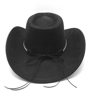 Close-up of black felt cowboy hat with sparkling rhinestone band and tassel detail