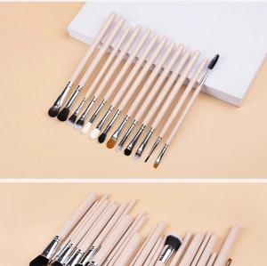 Detail of 24 professional makeup brushes showing soft synthetic bristles and pink handles
