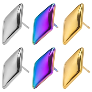 Detail of diamond-shaped geometric earrings in silver, gold, and rainbow finishes