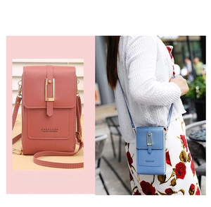 Detail view of pink and blue crossbody phone bags with clear touchscreen back window