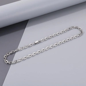 Detailed view of silver stainless steel geometric link chain with secure lobster clasp