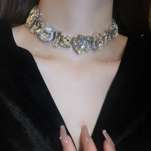 Detailed view of rhinestone choker necklace with mixed-cut crystals on silver base