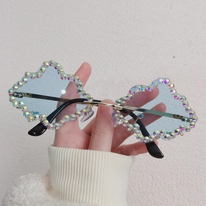 Cloud-shaped sunglasses with light blue lenses and sparkling rhinestone embellishments