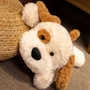 Close-up of soft beige plush dog toy with fluffy texture and cute brown ears