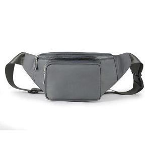 Detailed view of gray nylon waist bag with adjustable strap and black plastic buckle