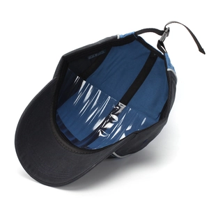 Detail view of cotton camper hat interior showing blue lining and adjustable strap