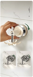 Detail showing rotating 6-prong suction hook with clockwise lock and unlock logic