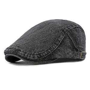 Classic washed black denim flat cap with adjustable metal buckle and stitching detail