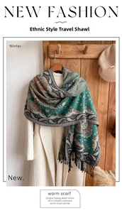 Close-up of ethnic paisley pattern shawl with fringe details on imitation cashmere fabric