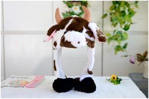 Detail of plush cow hat with moving ears, brown spotted faux fur and soft 3-in-1 design