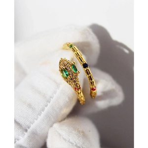 Golden snake-shaped open ring with green zircon eyes and colorful gemstone accents