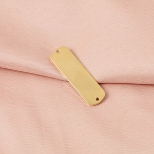 Detailed view of golden stainless steel rectangular connector tag for jewelry making