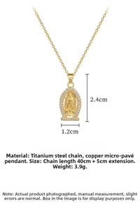 Detail of gold oval Virgin Mary pendant with pave rhinestones and titanium chain specs