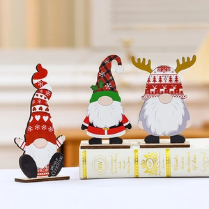 Three-piece wooden Christmas gnome desk ornaments in classic red and green festive colors