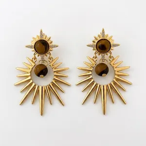 Elegant gold tiger eye starburst earrings with sparkling zircon accents on white background
