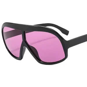 Oversized black frame sunglasses with trendy translucent pink lenses for a bold fashion look