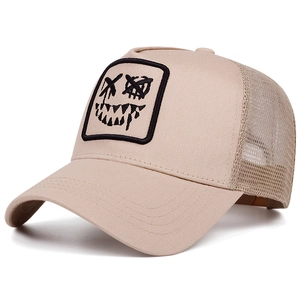 Detail view of the breathable mesh back and graffiti face patch on the trucker hat