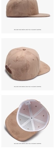 Macro detail of tan baseball cap featuring floral embroidery and adjustable inner strap