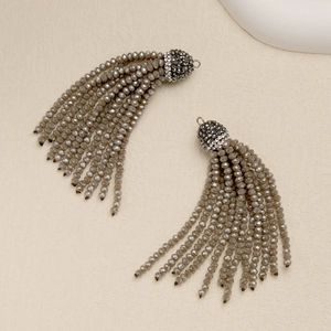 Detail of beaded tassel earrings with 2mm taupe beads and rhinestone metal caps