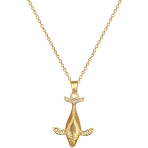 Luxurious gold titanium whale necklace with sparkling crystals on white background