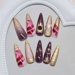 Purple and gold stiletto press-on nails with celestial star moon designs and marble art
