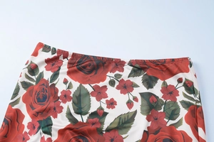 Detail of waist stitching and red rose floral print on white summer maxi skirt