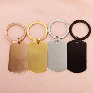 Polished rectangular stainless steel military tags in four metallic finishes on silk background