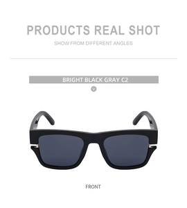 Front view of square oversized sunglasses in bright black frames with gray lenses
