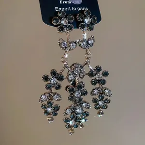 Vintage floral tassel earrings with green rhinestones and elegant drop design