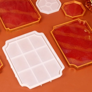 Macro detail of red and gold resin tray mold with shimmering glitter finish