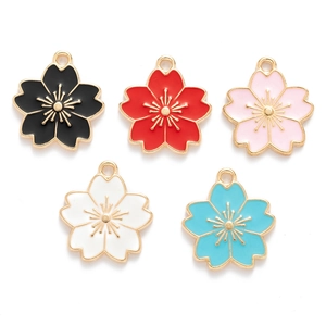 Flat lay of colorful enamel cherry blossom charms for DIY jewelry making and pendants