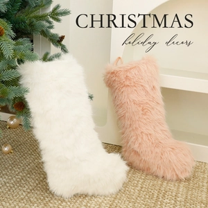 Plush Christmas stockings in pink and white faux fur for holiday tree decorations