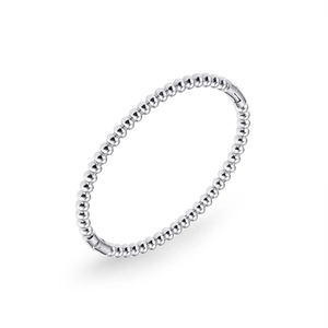 Macro shot of silver beaded metal bracelet with high-polish finish and hidden clasp