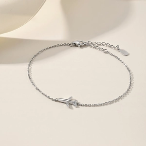 Detail of silver S925 airplane bracelet featuring zircon inlay and adjustable lobster clasp