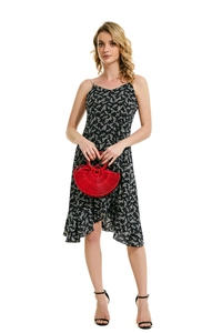 Detail of red semicircular bamboo handbag paired with black floral summer dress
