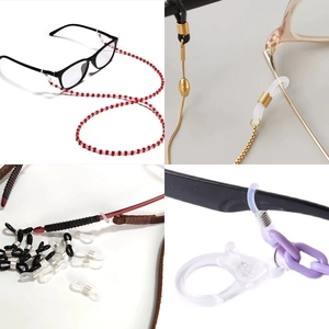 Detailed view of silicone eyeglass chain connectors and assorted beaded eyewear straps