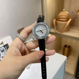 Luxury women's quartz watch with black leather strap and sparkling rhinestone dial