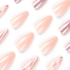 Pink glitter almond press-on nails with shimmering gradient and long drop shape design