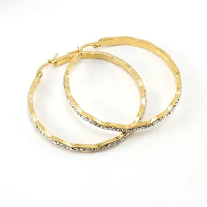 Golden wavy hoop earrings with micro-paved rhinestones in polished titanium steel