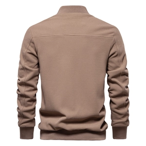 Detail view of khaki waffle knit jacket back with ribbed hem and structural stitching