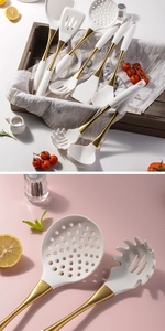 Macro detail of white silicone kitchen utensils with elegant gold-plated steel handles
