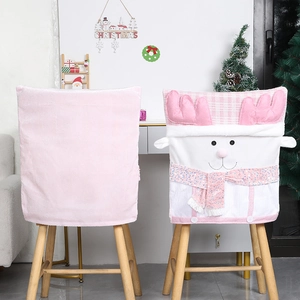 Detail of pink reindeer chair cover with soft plush fabric and sparkling sequin scarf