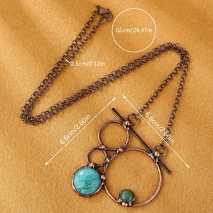 Vintage bronze necklace with geometric rings and natural green labradorite stones
