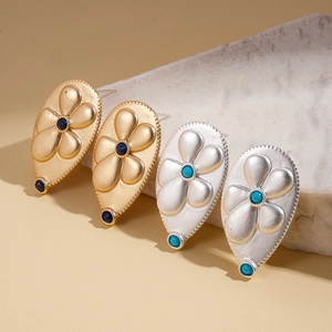 Metallic teardrop flower earrings in gold and silver with blue and green stones