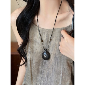 Ethnic gourd wood pendant necklace with metal cross inlay on vintage adjustable cord
