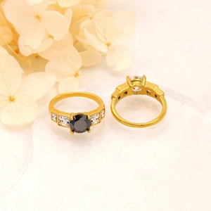 Detail of 18K gold plated rings with black zircon and vintage French design style