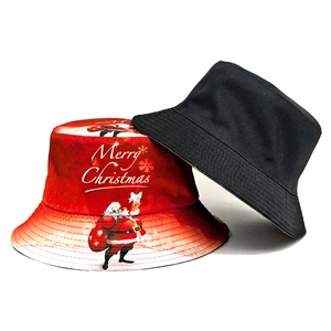 Reversible Christmas bucket hat in red with Santa print and solid black cotton fabric