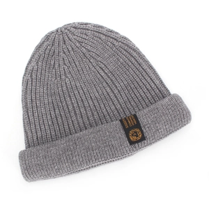 Detail of grey ribbed knit beanie featuring a wide cuff and black rectangular side label