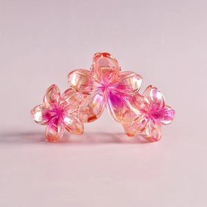 Detail of pink gradient resin flower hair claw clip with transparent 3D petals